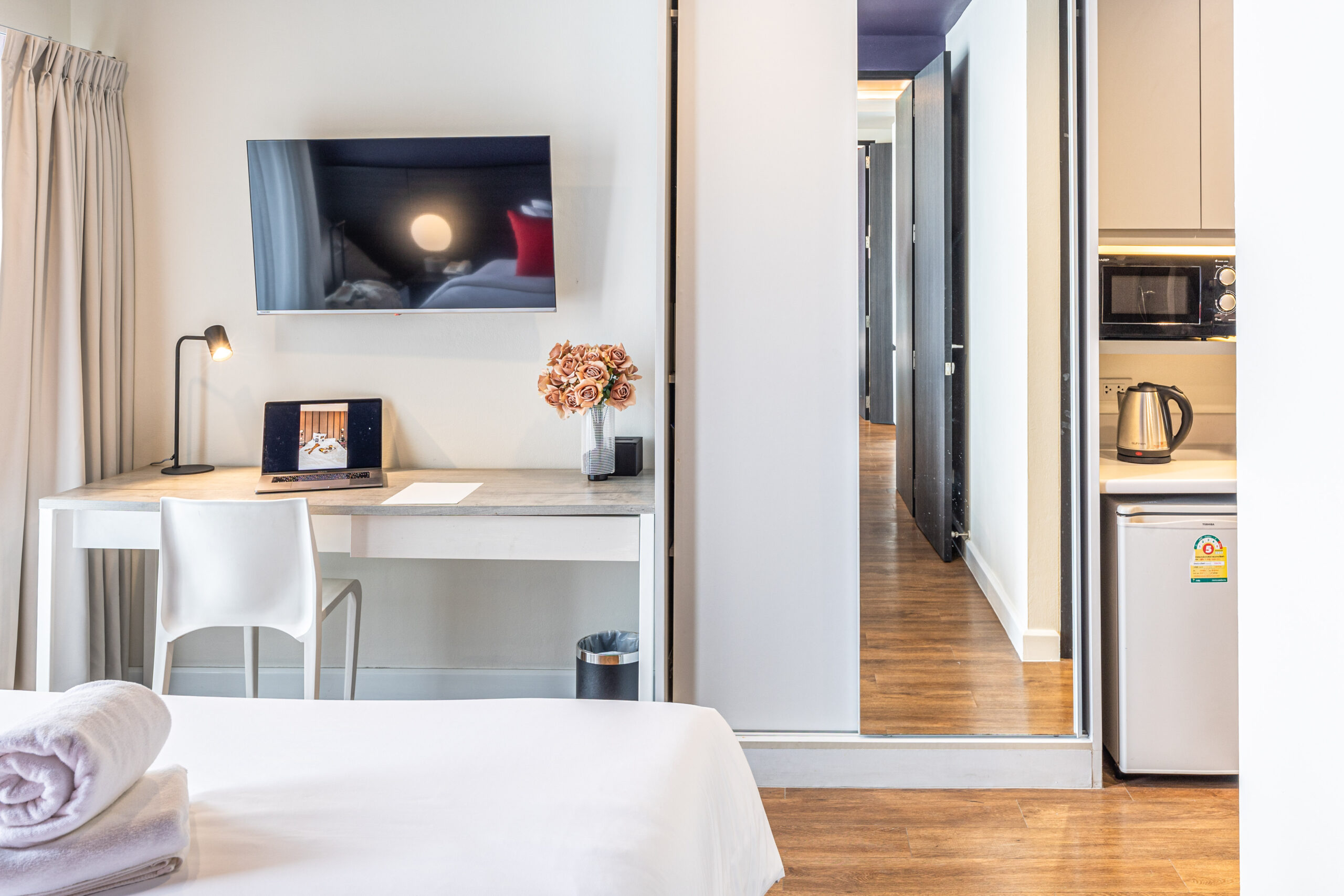 Modern guest room with connected layout and workspace at Red Crocodile Hotel