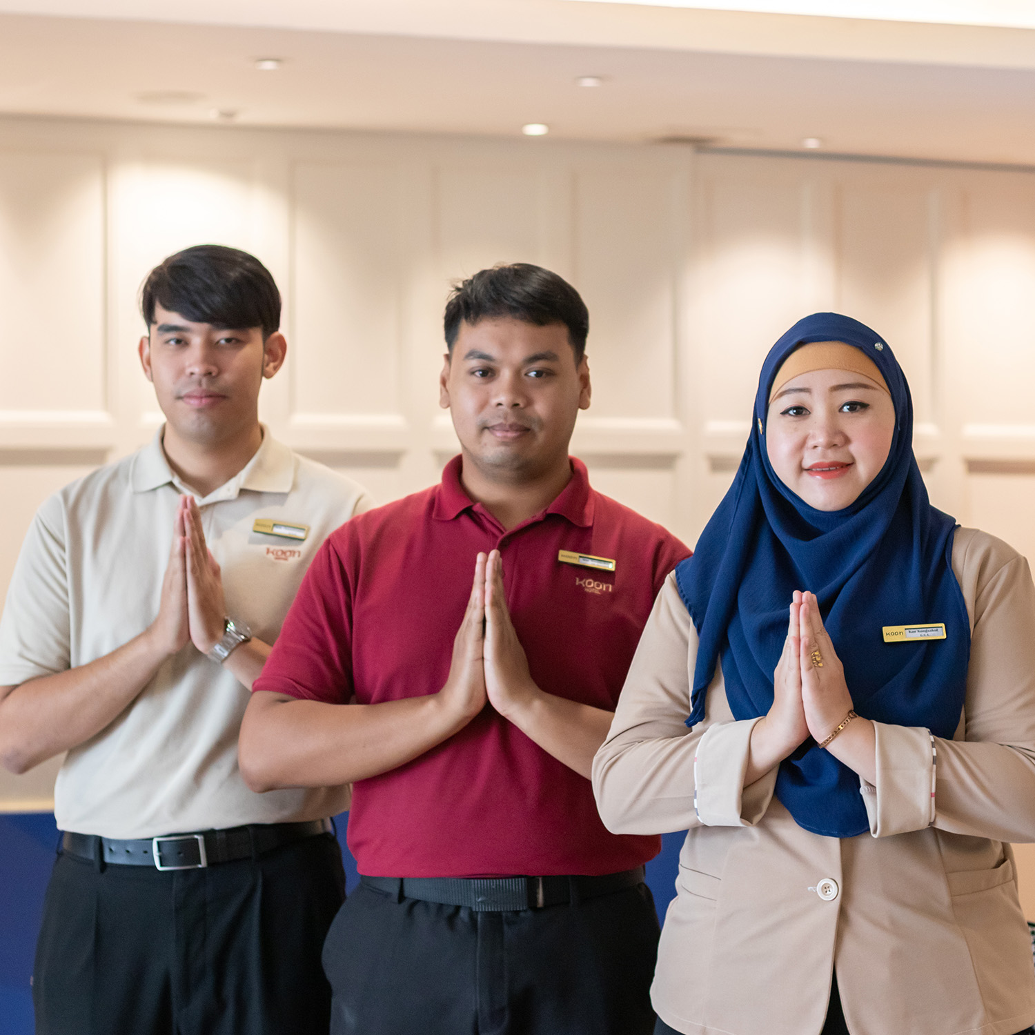Muslim staff at Red Crocodile Hotel welcoming guests with friendly hospitality at a Muslim-friendly hotel near BITEC Bangkok