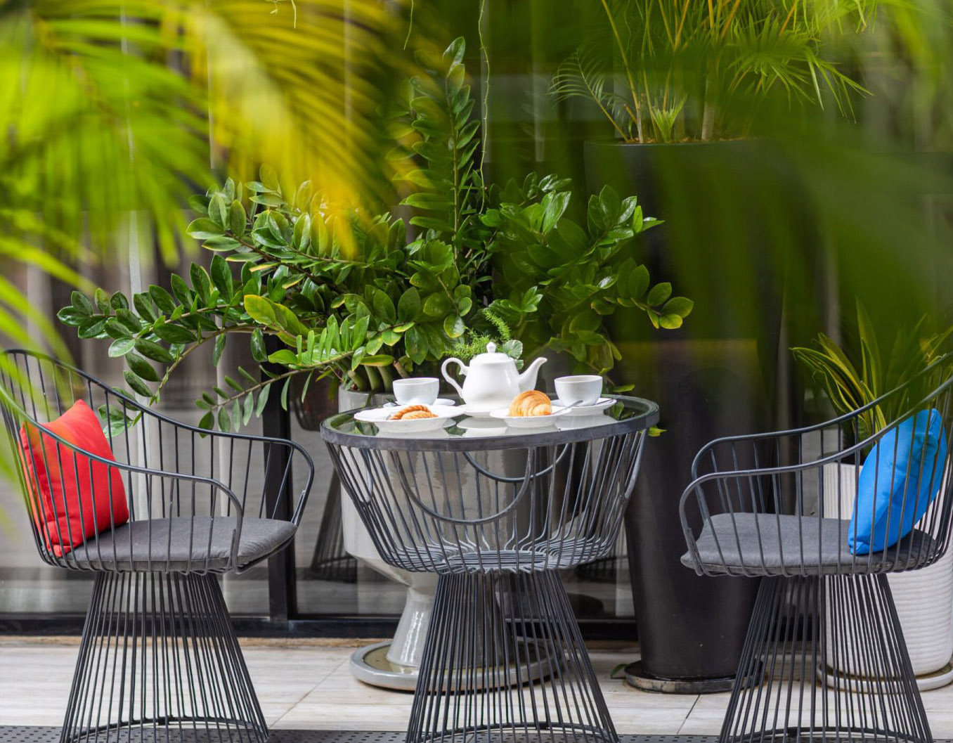 Cozy outdoor garden space for tea time at Red Crocodile Hotel, mobile view