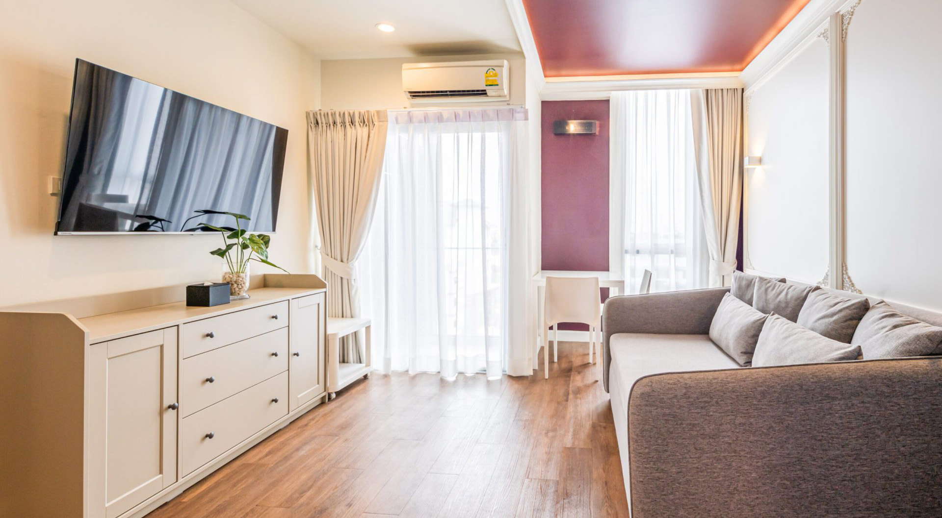 Spacious living room in suite at Red Crocodile Hotel near BITEC