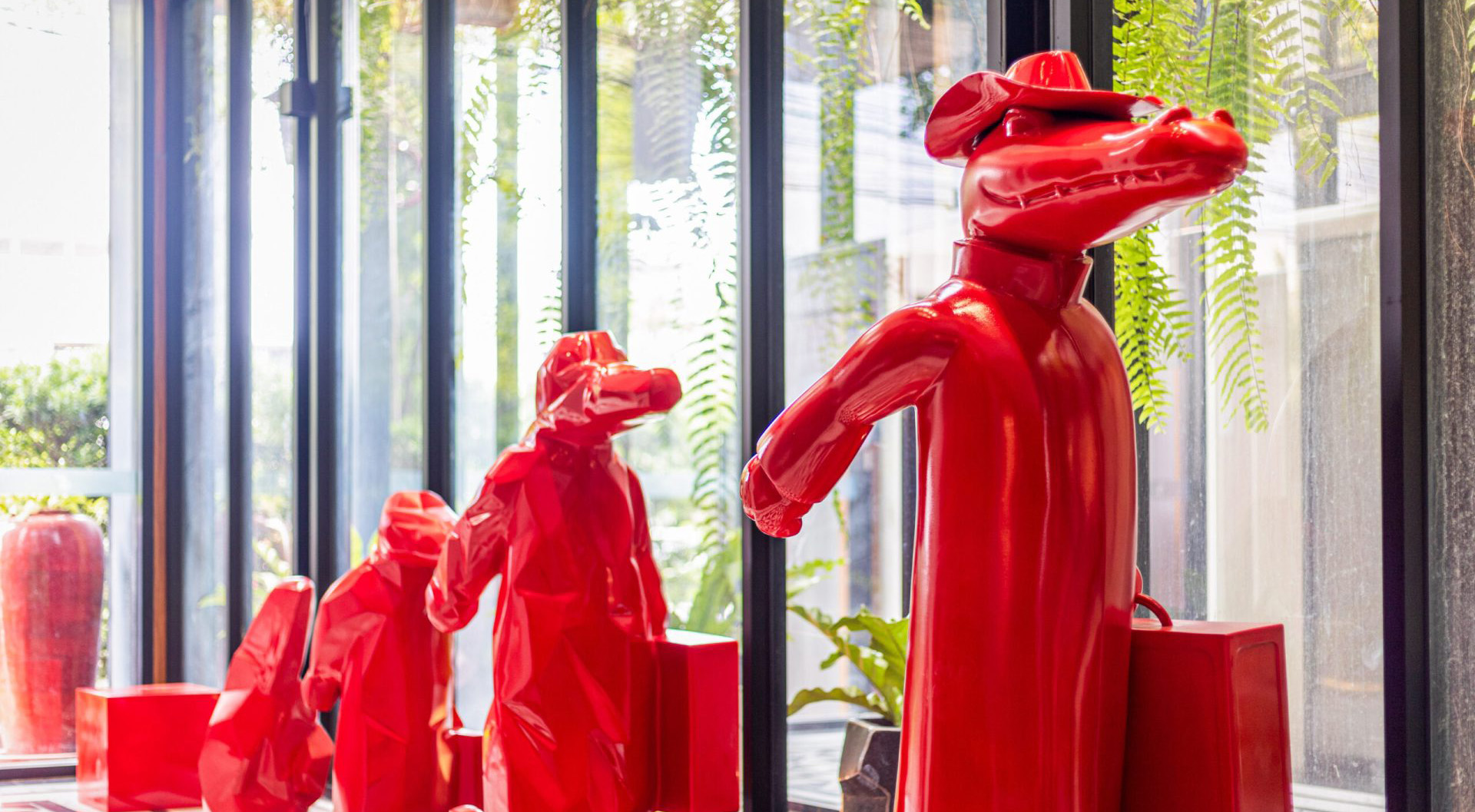 Red crocodile mascot statue at Red Crocodile Hotel entrance