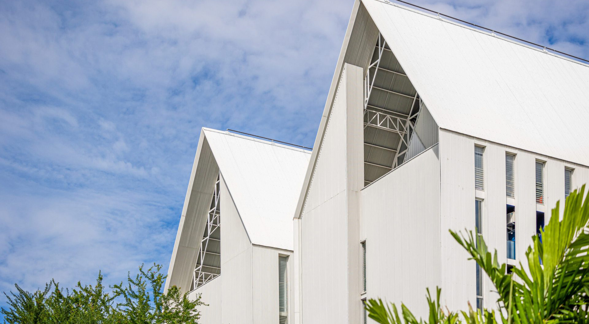 Red Crocodile Hotel exterior building design with modern white architecture near BITEC Bangna